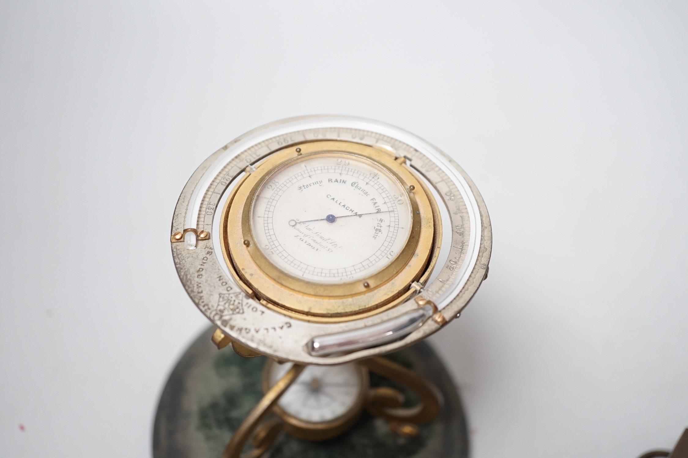 A Victorian Callaghan patent 'globe', desk barometer, thermometer and compass, 14cm high and a Sestrel compass